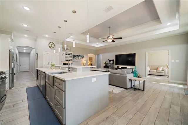 a large white kitchen with a large window