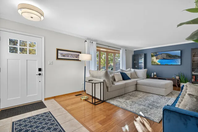 a living room with furniture and a rug