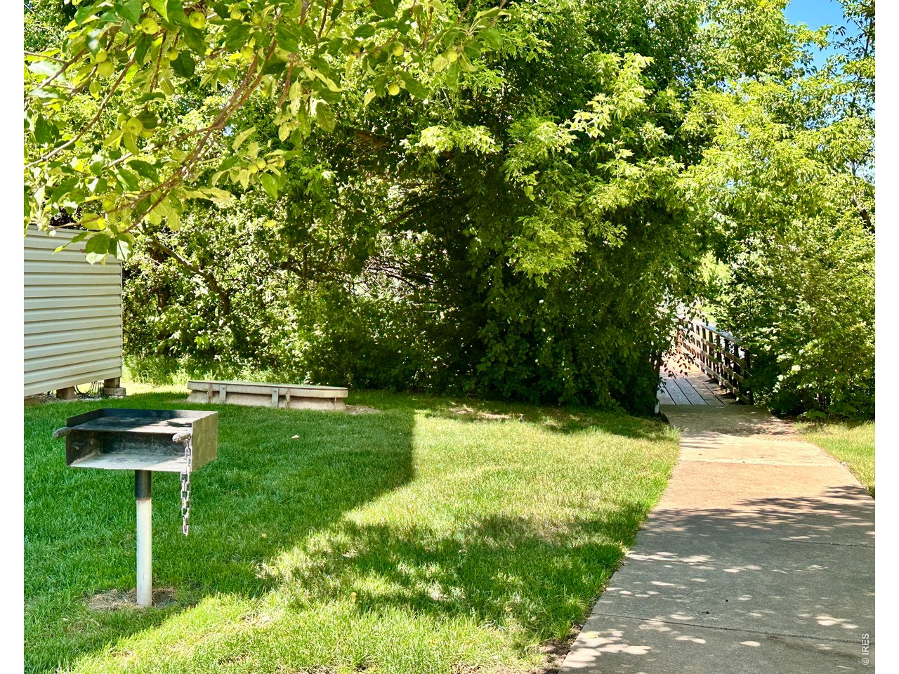 1705 Heatheridge Road, Unit 205 Fort Collins, CO 80526 - Photo 11 of 17 Community BBQ grills and trail leading to the common areas
