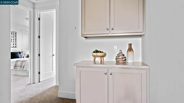 a kitchen with white cabinets and a sink