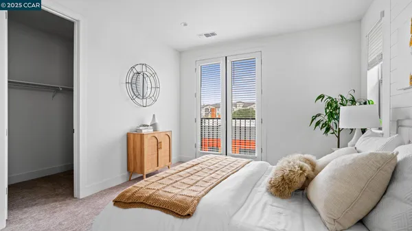 a bedroom with a bed and a table