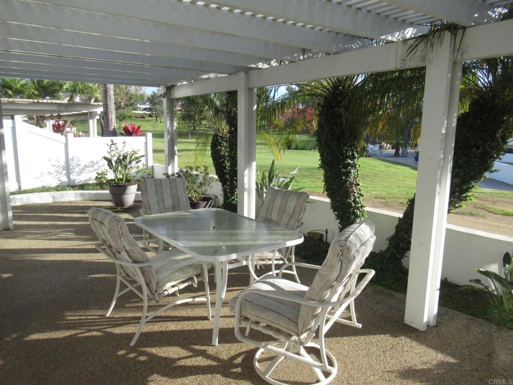 a dining room with furniture and garden view