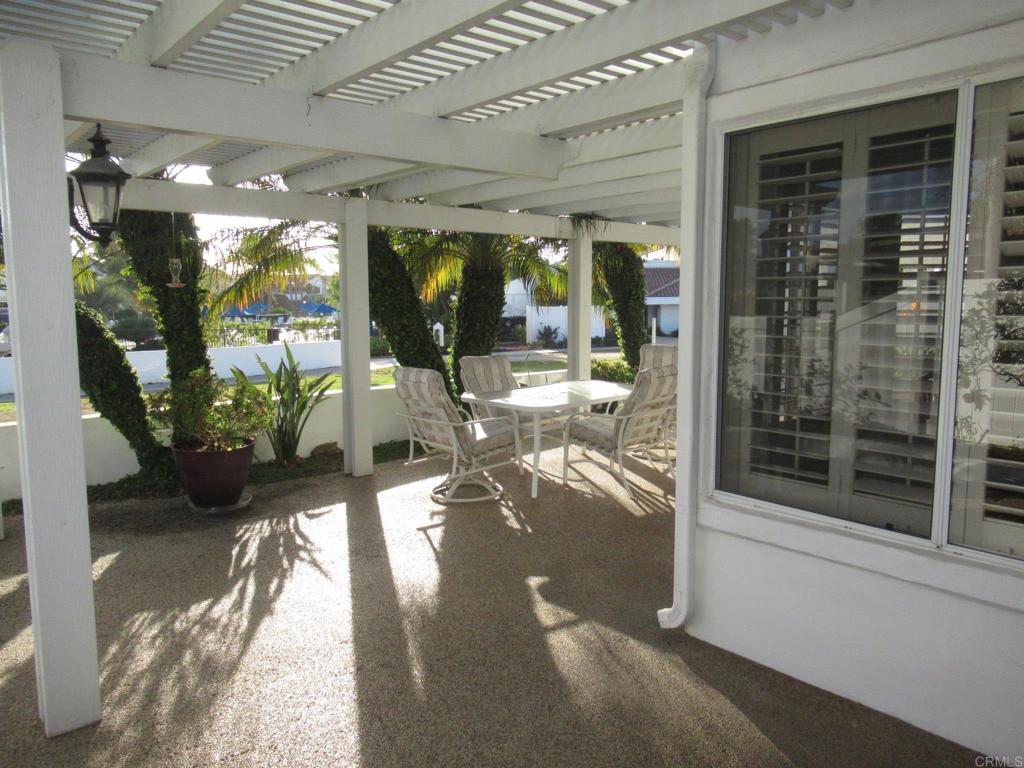4721 Majorca Way Oceanside, CA 92056 - Photo 13 of 23 a view of a porch with chairs and potted plants