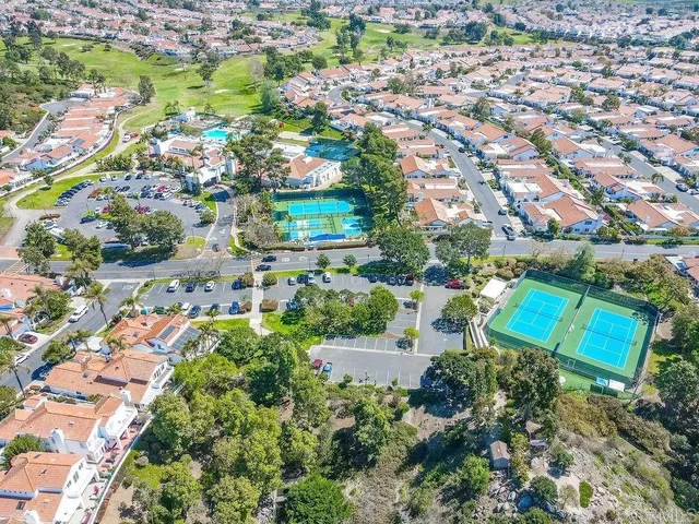 an aerial view of residential house with outdoor space and swimming pool