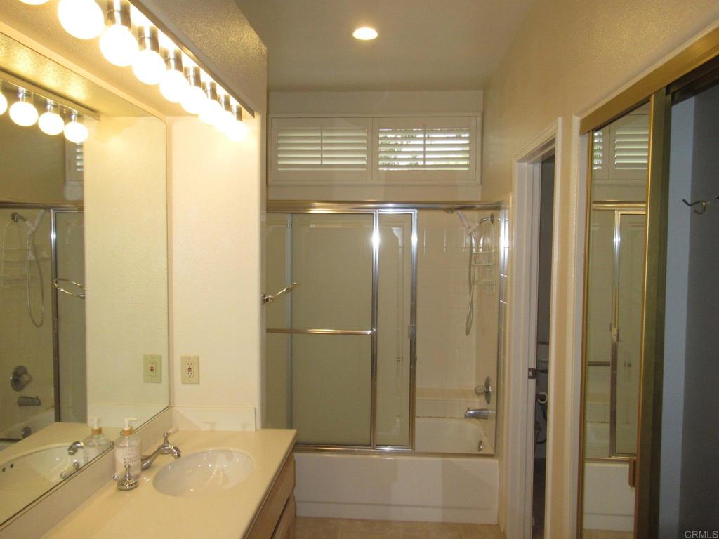 4721 Majorca Way Oceanside, CA 92056 - Photo 10 of 23 a bathroom with a shower and a sink