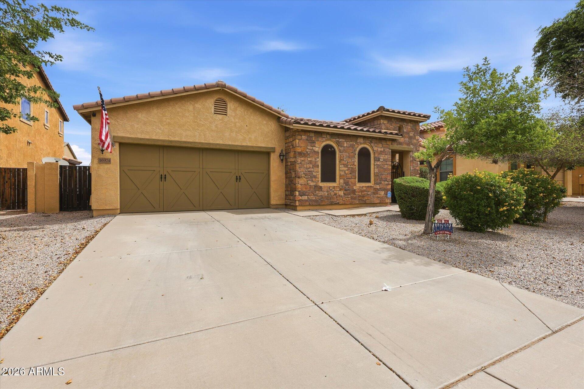 16974 West Rio Vista Lane Goodyear, AZ 85338 - Photo 2 of 38 Impressive Stone Facing