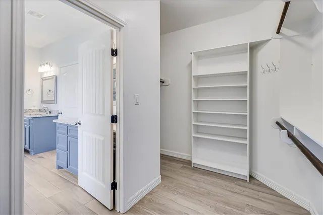 a view of an entryway with wooden floor