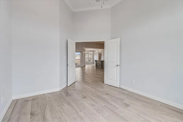 a bathroom with a granite countertop toilet sink and mirror