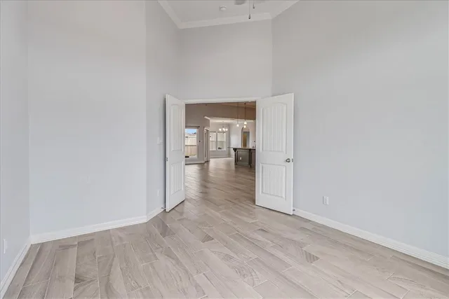 a bathroom with a granite countertop toilet sink and mirror