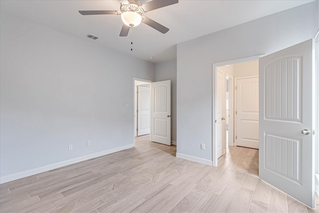 15501 Escapade Street Corpus Christi, TX 78418 - Photo 30 of 40 a view of an empty room with wooden floor