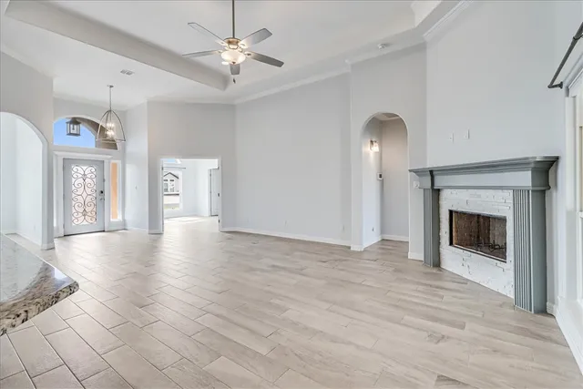 a kitchen with kitchen island a counter top space a sink stainless steel appliances and cabinets