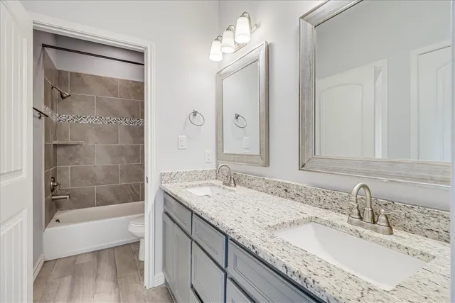 a bathroom with a shower and toilet