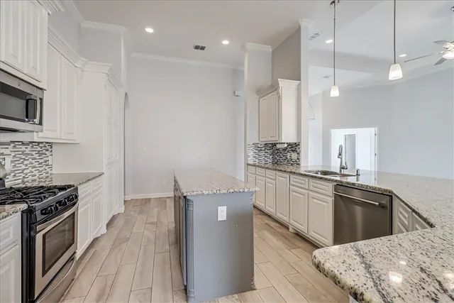 a utility room with a sink a washer and dryer