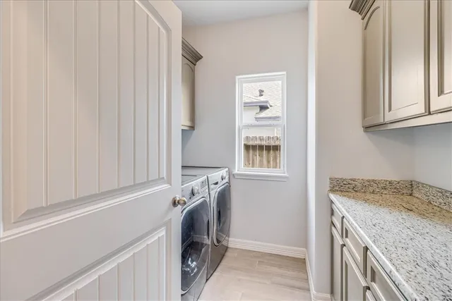 a front view of a house with a garden and plants