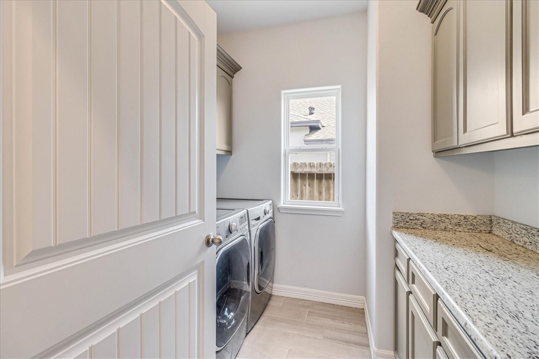 15501 Escapade Street Corpus Christi, TX 78418 - Photo 5 of 40 a utility room with a sink a washer and dryer