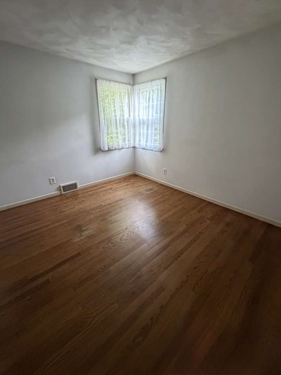 74 Birch Road Longmeadow, MA 01106 - Photo 15 of 38 an empty room with wooden floor and windows