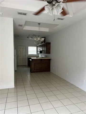 a kitchen with cabinets and window