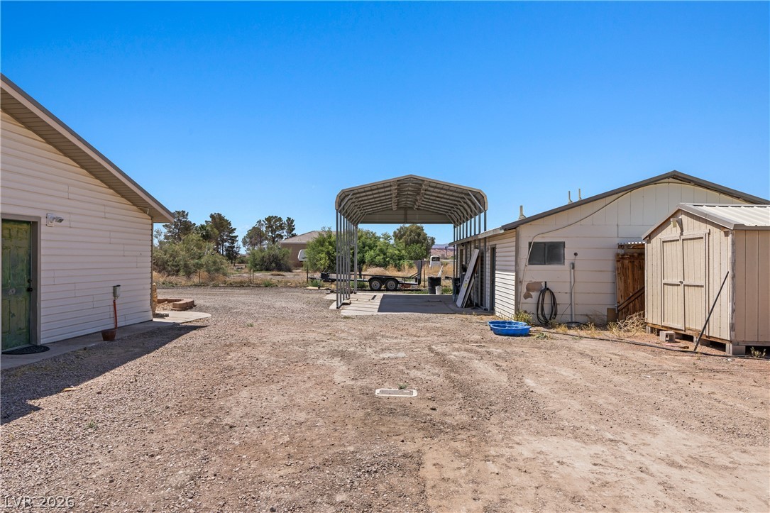 750 Leming Avenue Overton, NV 89040 - Photo 58 of 82 This property features multiple outbuildings and a large covered parking structure, offering versatile space.