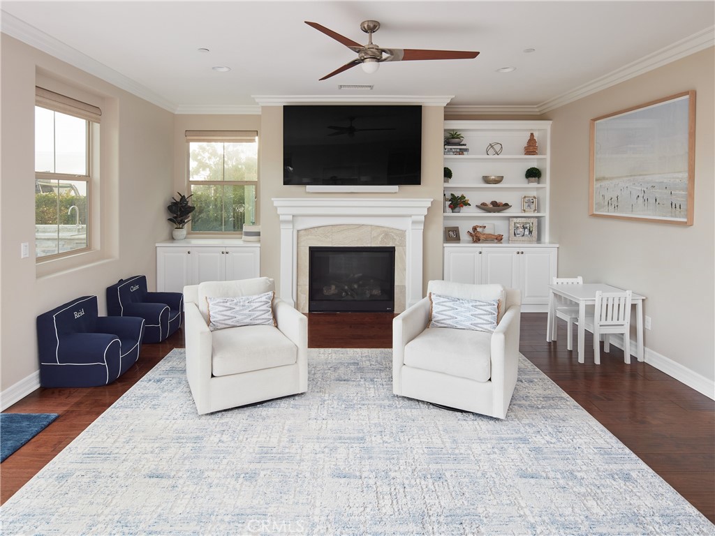 700 West Sycamore Avenue El Segundo, CA 90245 - Photo 13 of 42 a living room with furniture a flat screen tv and a fireplace
