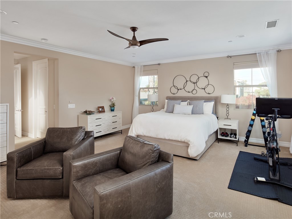 700 West Sycamore Avenue El Segundo, CA 90245 - Photo 23 of 42 a spacious bedroom with a bed a couch and a window