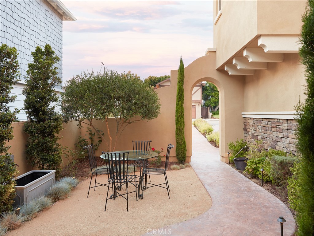 700 West Sycamore Avenue El Segundo, CA 90245 - Photo 3 of 42 a view of a patio with couches table and chairs and potted plants