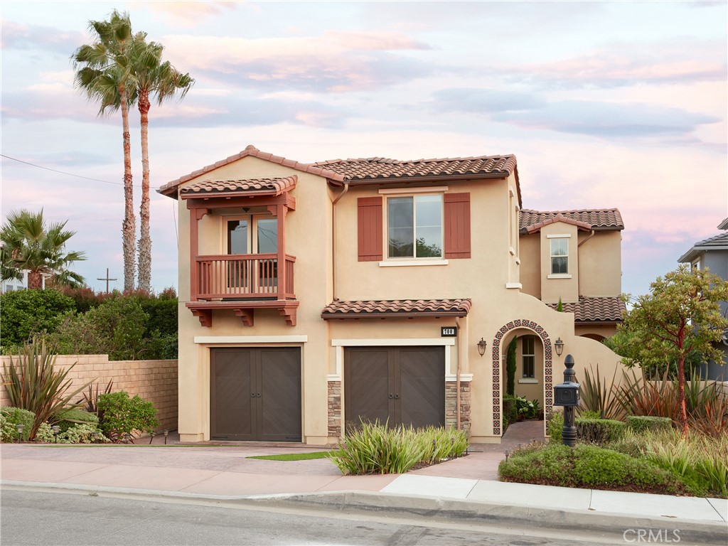 700 West Sycamore Avenue El Segundo, CA 90245 - Photo 41 of 42 a front view of a house with a garden and trees