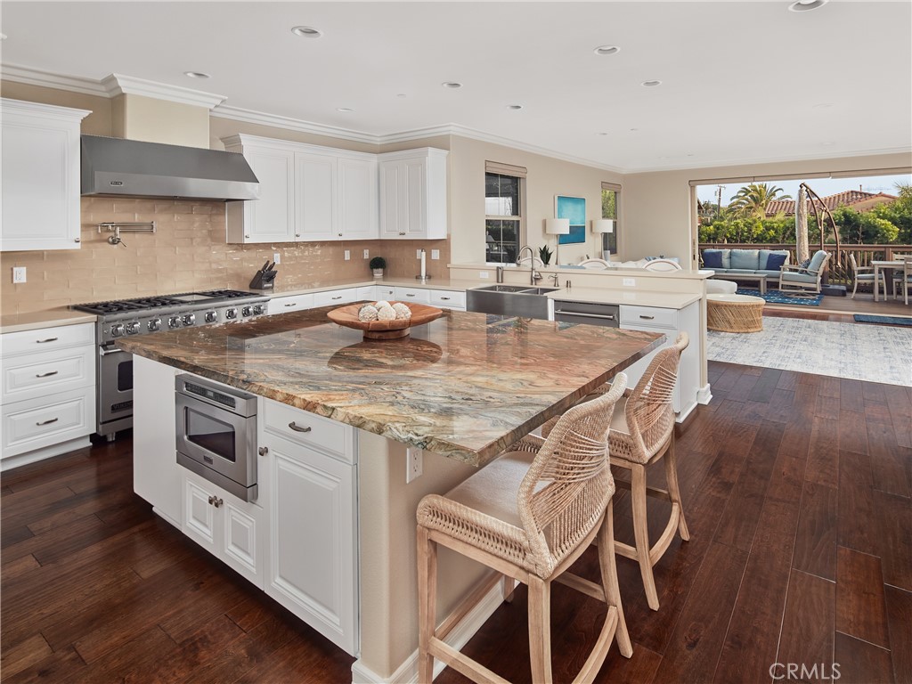 700 West Sycamore Avenue El Segundo, CA 90245 - Photo 7 of 42 a kitchen with a stove a sink and a refrigerator