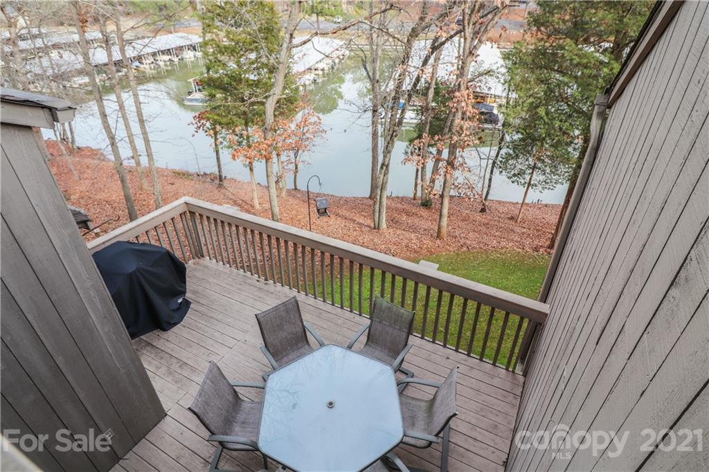 64 Ridgeport Road Lake Wylie, SC 29710 - Photo 2 of 37 a view of balcony with wooden floor and outdoor seating