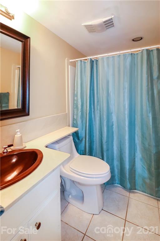 64 Ridgeport Road Lake Wylie, SC 29710 - Photo 18 of 37 a bathroom with a sink a toilet and a mirror