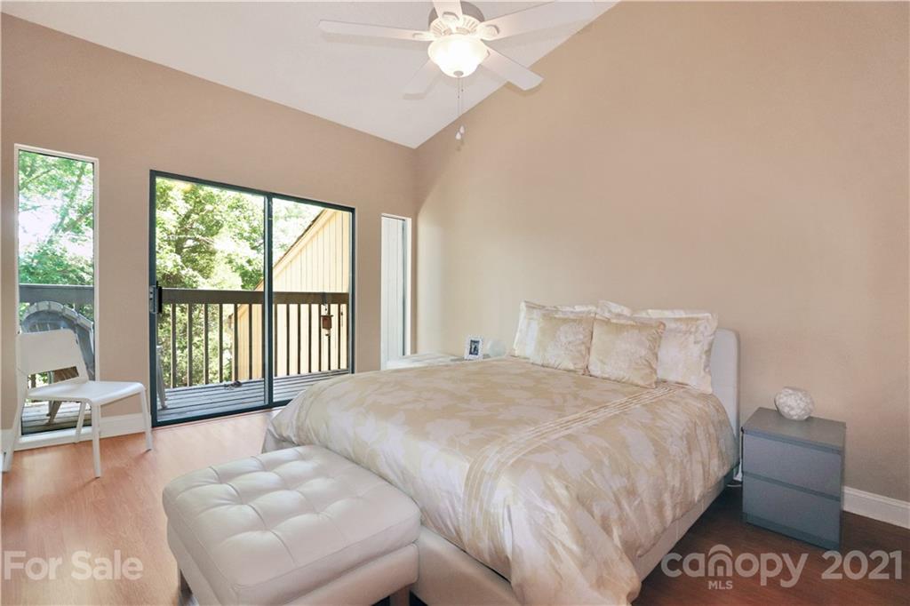 64 Ridgeport Road Lake Wylie, SC 29710 - Photo 20 of 37 a bedroom with a large bed and a large window