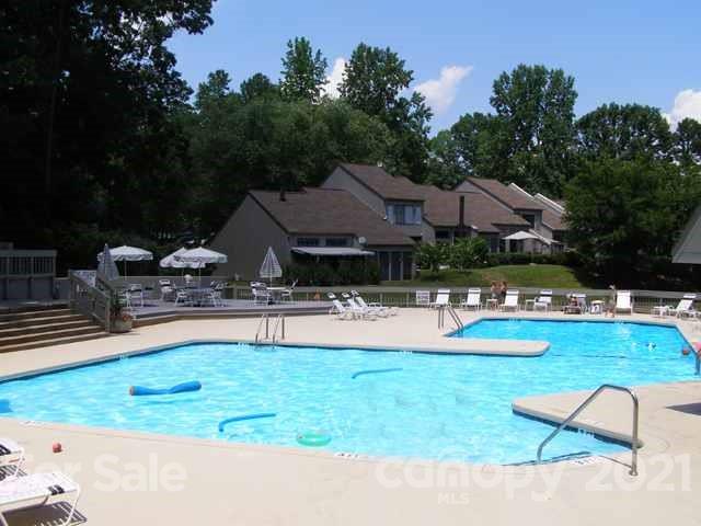 64 Ridgeport Road Lake Wylie, SC 29710 - Photo 33 of 37 a swimming pool view with a seating space and a garden view
