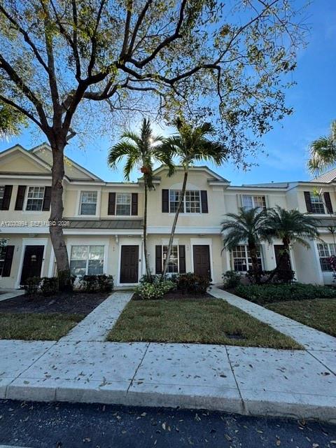 192 Southwest 96th Avenue, Unit 192 Plantation, FL 33324 - Photo 2 of 15 front view of house with a yard