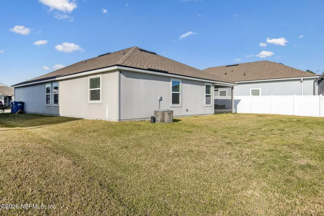 an aerial view of a house with a lake view