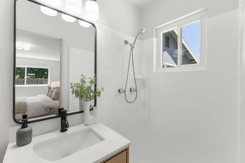 a bedroom with a door and a bathroom