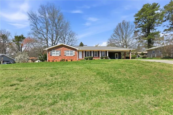a house with garden in front of it
