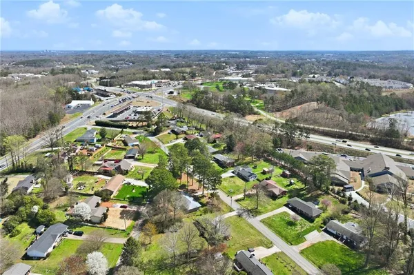 an aerial view of residential houses with outdoor space