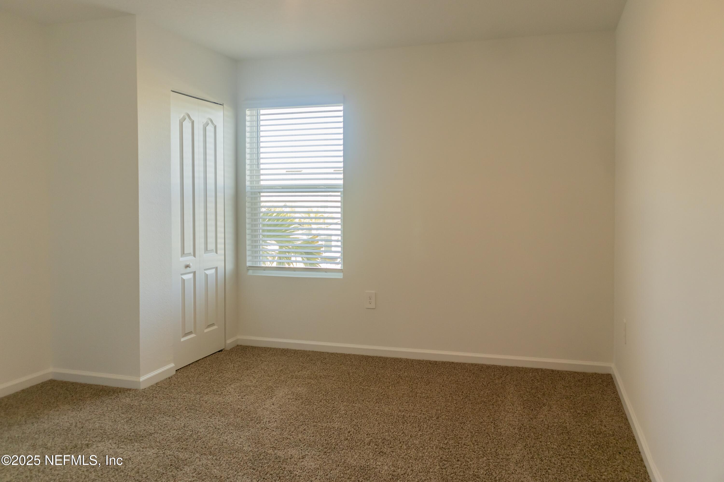 1700 Bridger Trace Middleburg, FL 32068 - Photo 12 of 14 a view of an empty room with a window