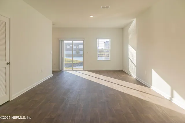 an empty room with windows