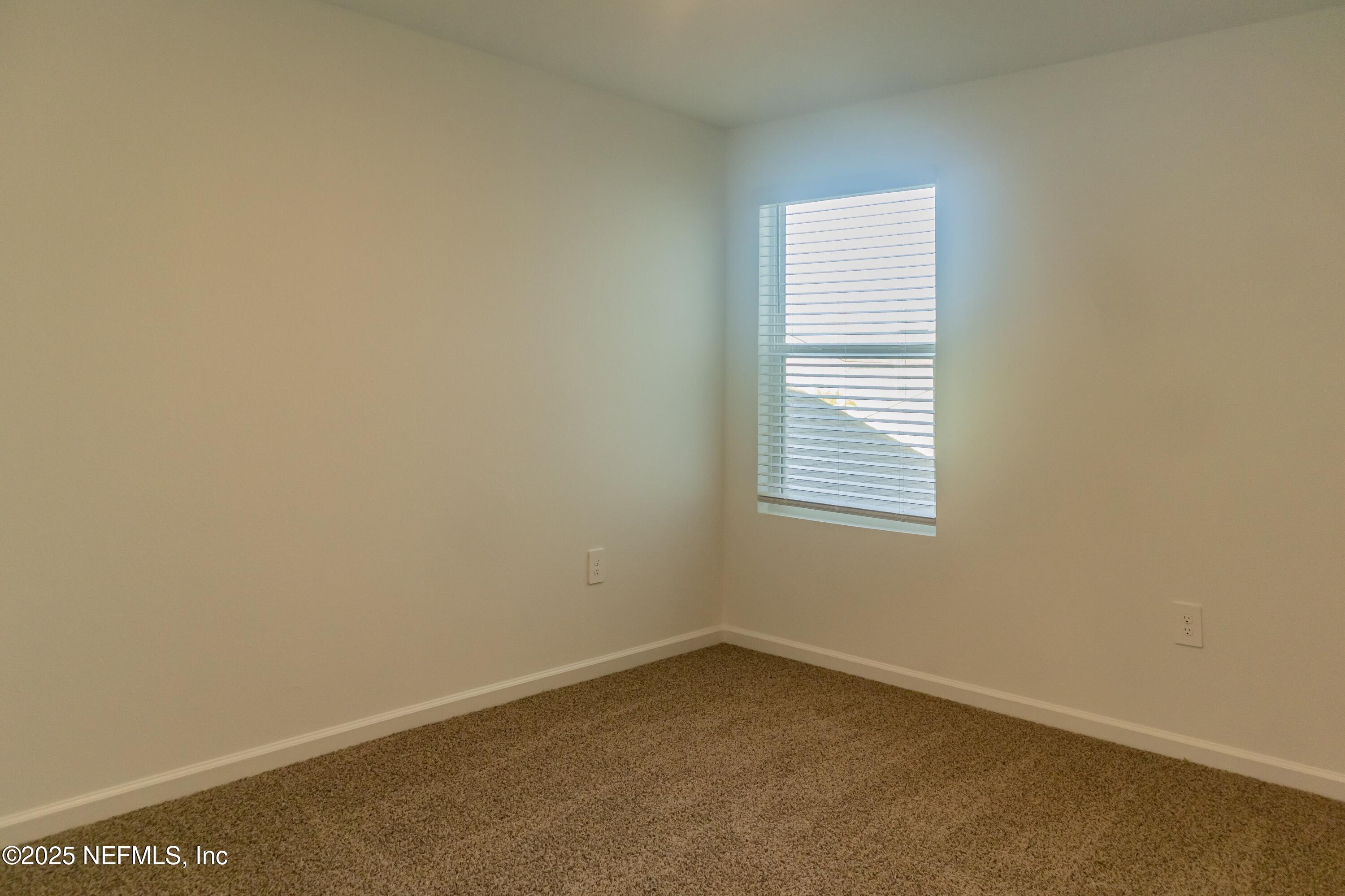 1700 Bridger Trace Middleburg, FL 32068 - Photo 7 of 14 an empty room with a window