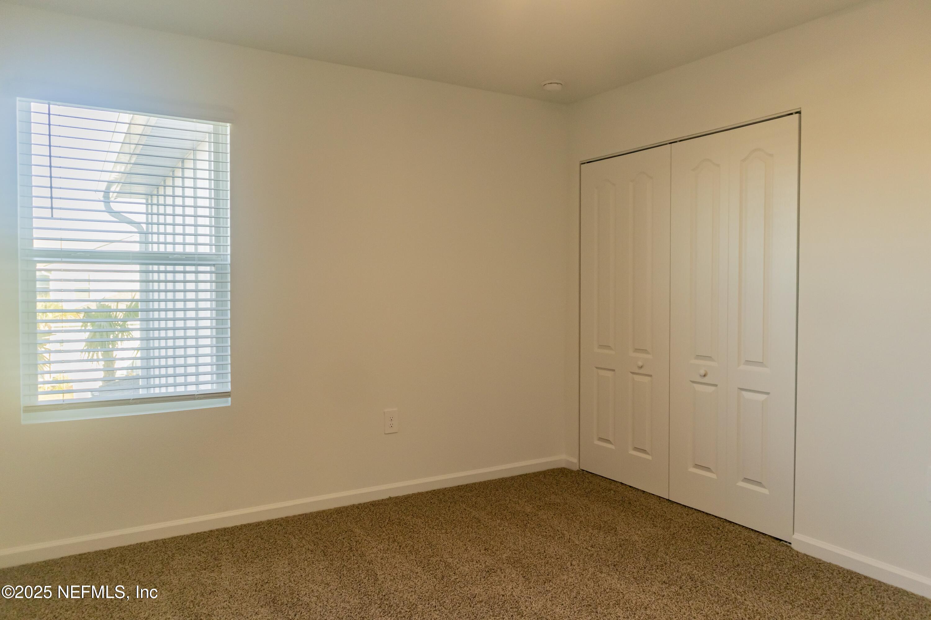 1700 Bridger Trace Middleburg, FL 32068 - Photo 8 of 14 a view of an empty room with a window