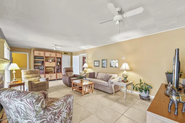 a kitchen with a sink cabinets and wooden floor