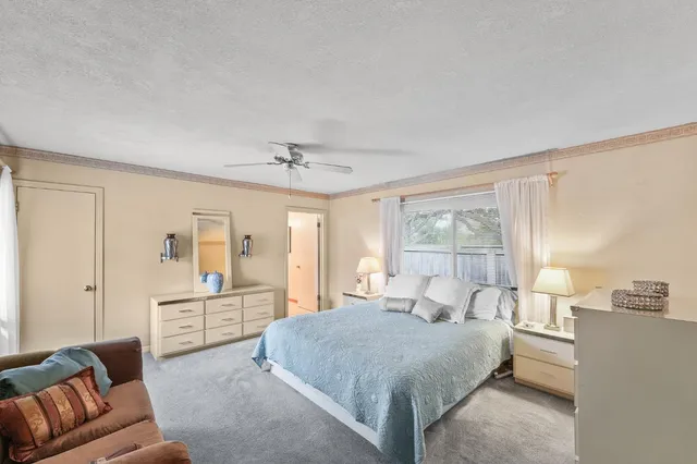 a kitchen with a stove a sink and a wooden cabinets