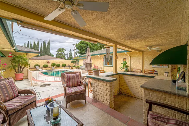 a backyard of a house with outdoor seating