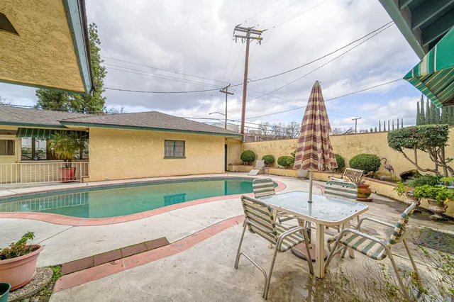a kitchen with stainless steel appliances a refrigerator and a sink
