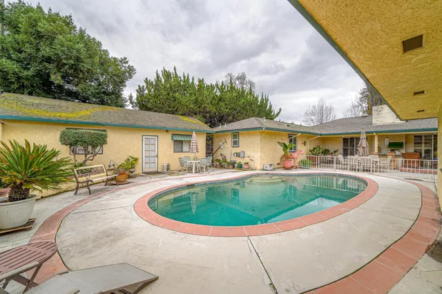 an aerial view of residential houses with city view