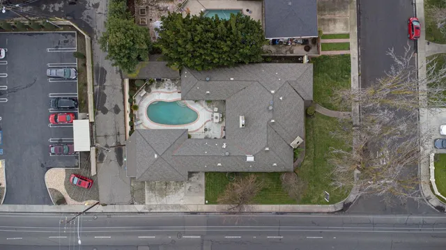 an aerial view of a house with outdoor space