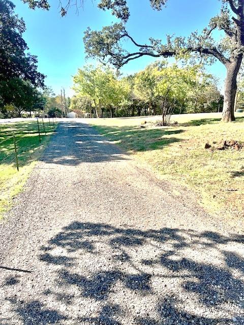 4228 Spring Meadow Lane Flower Mound, TX 75028 - Photo 2 of 2 a view of a yard with an empty space