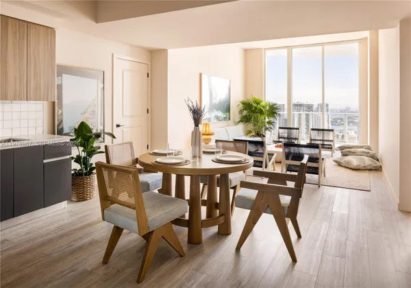 a dining room with furniture window and wooden floor