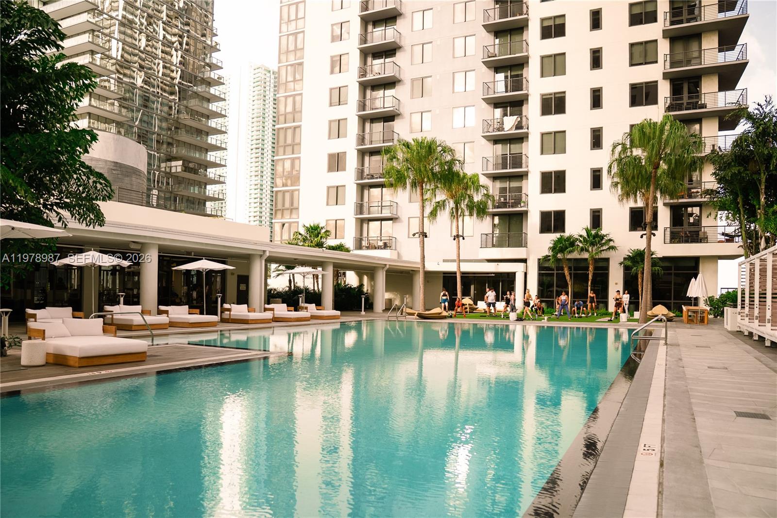 275 Southwest 6th Street, Unit 2007 Miami, FL 33130 - Photo 11 of 24 a view of a swimming pool with outdoor seating