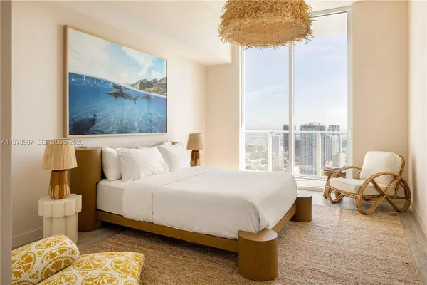 a bedroom with a bed and a couch